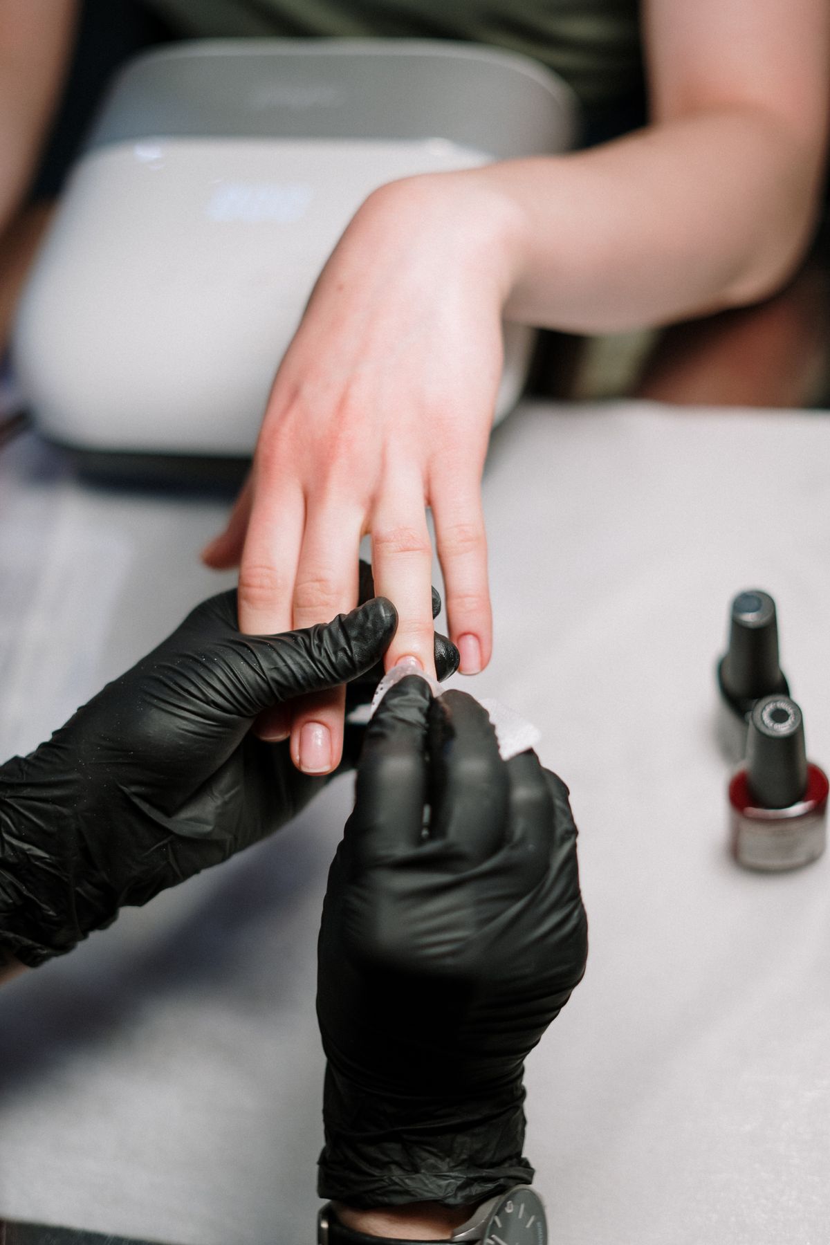 Manicure in progress at PinkLuxe Nail Bar